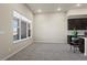 Bright living room with a large window offering lots of natural light, and modern gray color scheme at 350 High Point Dr # C201, Longmont, CO 80504