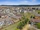 Wide aerial shot of a neighborhood with well-maintained homes and scenic surroundings at 4077 Forever Cir, Castle Rock, CO 80109