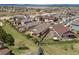 Beautiful aerial view of a neighborhood showcasing manicured lawns and mature trees at 4077 Forever Cir, Castle Rock, CO 80109