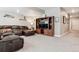 Basement living area with a comfortable leather sofa and entertainment center at 4077 Forever Cir, Castle Rock, CO 80109