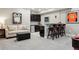Basement featuring a wet bar with seating and a comfortable seating area at 4077 Forever Cir, Castle Rock, CO 80109