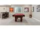 Basement billiard area featuring a pool table with seating and a wet bar at 4077 Forever Cir, Castle Rock, CO 80109