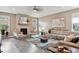 Bright and airy living room featuring a fireplace, comfortable seating, and stylish decor at 4077 Forever Cir, Castle Rock, CO 80109