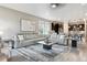 A contemporary living room boasts a huge sectional sofa, recessed lights, and an open floor plan at 4077 Forever Cir, Castle Rock, CO 80109