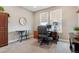 Bright home office with a large window, neutral carpet, and classic wooden furniture at 4077 Forever Cir, Castle Rock, CO 80109