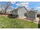 Spacious backyard with lush green lawn and patio, offering an ideal space for recreation and relaxation at 10275 Quail St, Westminster, CO 80021