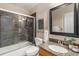 Bathroom with a glass-enclosed shower, granite countertop, and modern fixtures at 10275 Quail St, Westminster, CO 80021