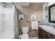 Stylish bathroom with decorative tile accents, built-in shelving, and a modern vanity at 10275 Quail St, Westminster, CO 80021
