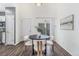Dining area with a modern table, stylish chairs, and access to the patio at 10275 Quail St, Westminster, CO 80021