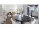 Open-concept living and dining area with hardwood floors and natural light at 10275 Quail St, Westminster, CO 80021