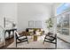 Inviting living room with large windows, modern furniture, and hardwood floors at 10275 Quail St, Westminster, CO 80021