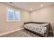 Basement bedroom with a daybed and window shutters at 2932 Low Meadow Blvd, Castle Rock, CO 80109