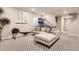 Spacious basement rec room, featuring a rowing machine and comfortable seating at 2932 Low Meadow Blvd, Castle Rock, CO 80109