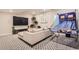 Finished basement recreation area with sectional sofa and basketball game at 2932 Low Meadow Blvd, Castle Rock, CO 80109