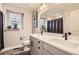 Main bathroom with double sinks and modern gray cabinets at 2932 Low Meadow Blvd, Castle Rock, CO 80109
