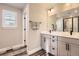 Double vanity bathroom with large shower and modern fixtures at 2932 Low Meadow Blvd, Castle Rock, CO 80109