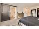 Main bedroom with barn door entry and large dresser at 2932 Low Meadow Blvd, Castle Rock, CO 80109
