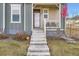 Front entrance with concrete steps leading to a covered porch at 2932 Low Meadow Blvd, Castle Rock, CO 80109