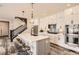 Modern kitchen featuring a large island, stainless steel appliances, and white cabinetry at 2932 Low Meadow Blvd, Castle Rock, CO 80109