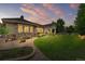 Spacious backyard with manicured lawn, landscaping, and stone accents creating an inviting outdoor living space at 14310 Inca St, Westminster, CO 80023