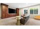The finished basement features built-ins and large windows for natural light at 14310 Inca St, Westminster, CO 80023