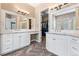 This bathroom features double vanities, modern lighting, and a walk-in closet at 14310 Inca St, Westminster, CO 80023