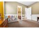 Bedroom with carpet featuring wall shelving, beadboard, and views of a powder room at 14310 Inca St, Westminster, CO 80023
