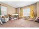 Cozy bedroom with carpet features a bunk bed and a window with yellow curtains at 14310 Inca St, Westminster, CO 80023