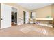 Bedroom showcases a bunk bed, neutral carpet, and light-filled windows for a warm and inviting space at 14310 Inca St, Westminster, CO 80023