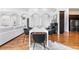 Dining room with hardwood floors, elegant arches, and seating for six at 14310 Inca St, Westminster, CO 80023