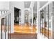 Grand foyer boasts soaring ceilings, columns, and hardwood floors, creating an inviting entrance at 14310 Inca St, Westminster, CO 80023