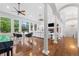 Spacious living area with hardwood floors, white columns, comfortable seating, and large windows offering ample light at 14310 Inca St, Westminster, CO 80023