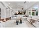 Spacious living room with elegant pillars, a large sectional, and hardwood floors at 14310 Inca St, Westminster, CO 80023