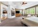 Spacious main bedroom features a brick fireplace, a ceiling fan, and natural light at 14310 Inca St, Westminster, CO 80023