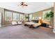 Spacious main bedroom with a ceiling fan, natural light, and ample seating at 14310 Inca St, Westminster, CO 80023