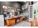 Office features hardwood floors, large window, and custom built-in desk at 14310 Inca St, Westminster, CO 80023