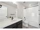 Modern bathroom showcasing vanity and shower and tub combo at 21142 E 63Rd Dr, Aurora, CO 80019