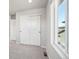 Bedroom with carpet, large closet, and natural light from window with neighborhood views at 21142 E 63Rd Dr, Aurora, CO 80019