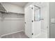 Walk-in closet with carpet and shelving at 21142 E 63Rd Dr, Aurora, CO 80019