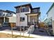 Stylish two-story home with a modern exterior, featuring a well-manicured front yard and contemporary design at 21142 E 63Rd Dr, Aurora, CO 80019
