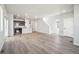 Expansive living area showcasing wood flooring, natural light, and a modern, open layout at 21142 E 63Rd Dr, Aurora, CO 80019