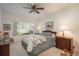 Comfortable bedroom featuring soft lighting, a window with a view, and classic furniture for a peaceful retreat at 8775 W Berry Ave # 101, Littleton, CO 80123