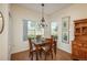 Cozy dining room with natural light, table for four, and charming decor at 8775 W Berry Ave # 101, Littleton, CO 80123