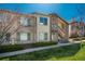 Charming condo with well-kept lawn, private entry, and exterior staircase at 8775 W Berry Ave # 101, Littleton, CO 80123