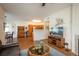 Living room extends into dining area and kitchen, creating an open and inviting atmosphere at 8775 W Berry Ave # 101, Littleton, CO 80123