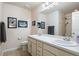 Clean bathroom featuring a double vanity and a shower at 3565 E 140Th Pl, Thornton, CO 80602