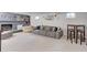 Spacious finished basement with a fireplace, seating area, bar, and ample room at 12020 W Alabama Pl, Lakewood, CO 80228
