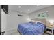 Cozy bedroom with a comfortable bed, a neutral color scheme, and great natural light from the large windows at 12020 W Alabama Pl, Lakewood, CO 80228