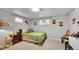 Bedroom with neutral walls, carpet floors, two windows, and simple furniture at 12020 W Alabama Pl, Lakewood, CO 80228