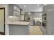 Well-equipped kitchen with stainless appliances, granite countertops, modern cabinetry and a decorative backsplash at 12020 W Alabama Pl, Lakewood, CO 80228